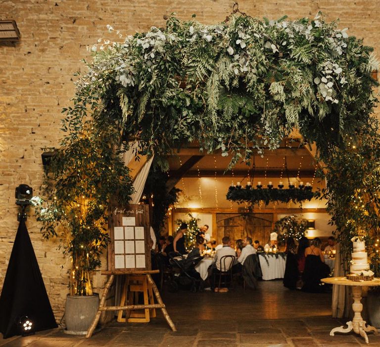 Foliage arrangement for entrance to barn reception