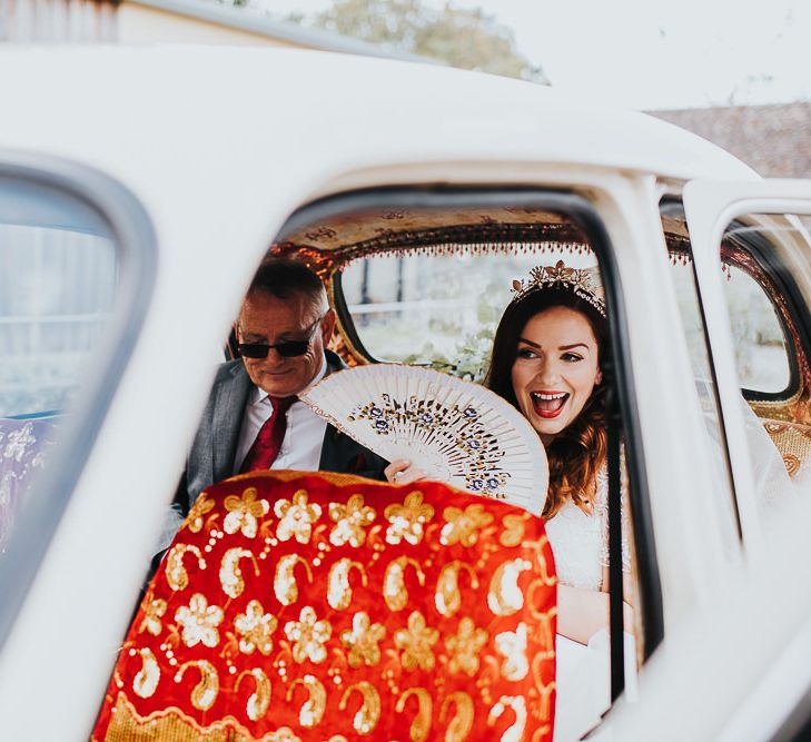 Bride in bridal crown makes her way to ceremony