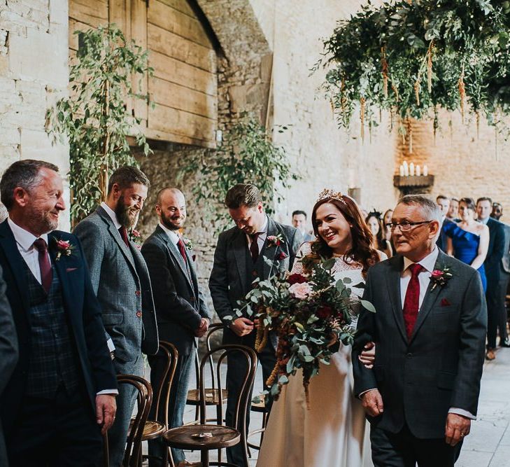 Bride walking down the aisle at Stone Barn