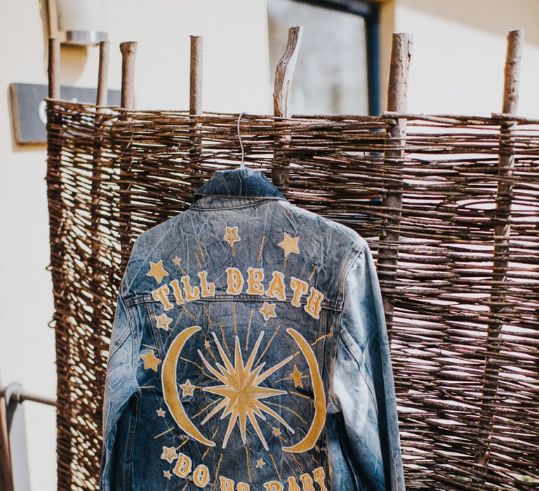 Personalised denim jacket for bride with light box sign and peg board decor