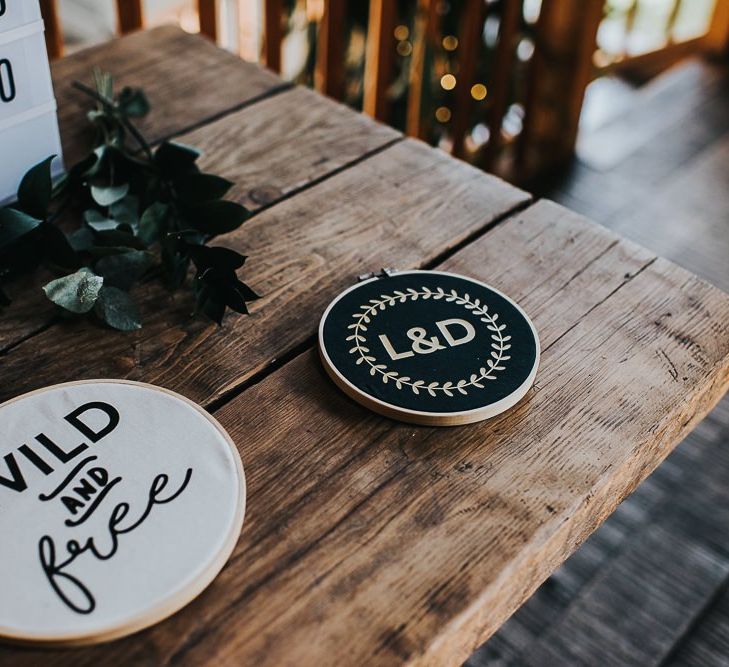 Personalised wedding decor with pennants, light box sign and peg boards