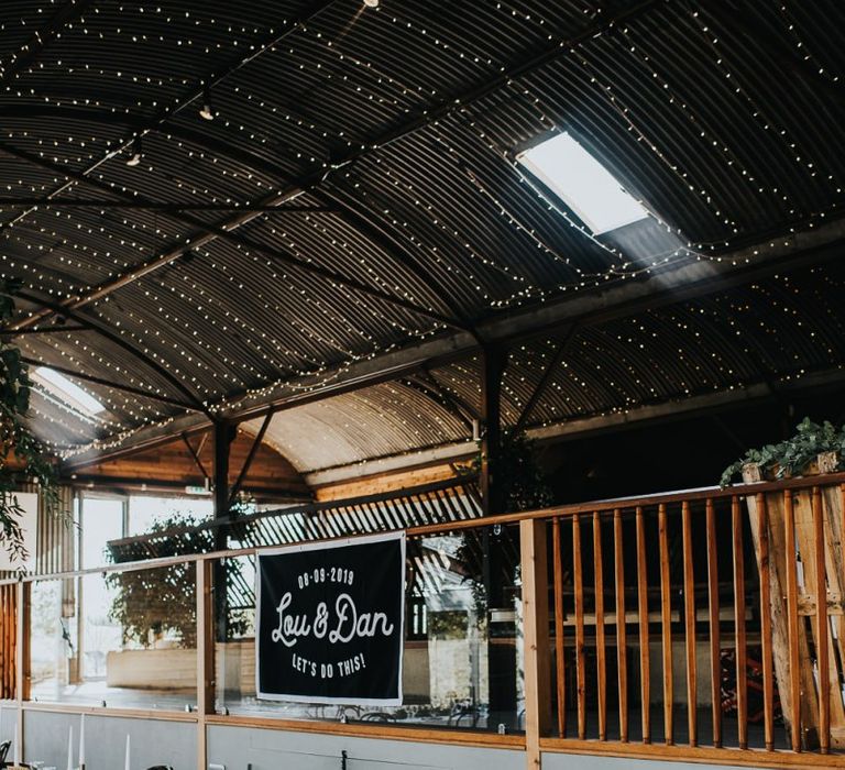 Personalised wedding sign with fairy light canopy and light box sign