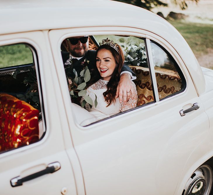 Bride and groom in wedding car