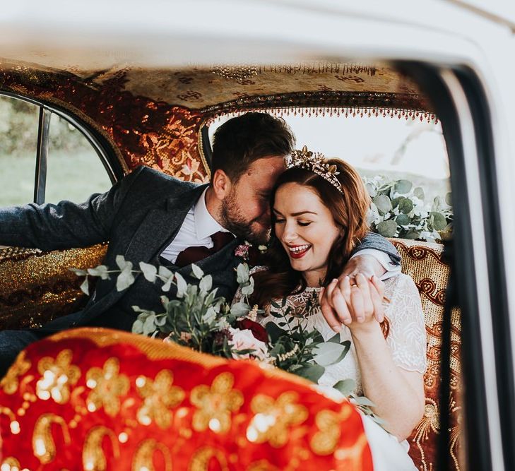 Bride and groom in wedding car