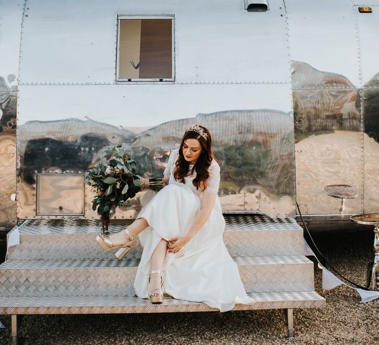 Bride in boho E&amp;W Couture bridal two-piece with Miu Miu shoes