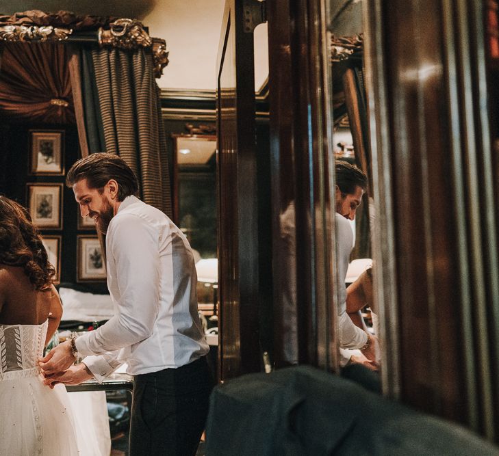 Bride and groom getting ready together on the wedding morning