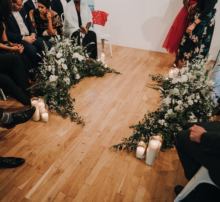 Wedding ceremony flowers and church candles at Pump House Gallery, Battersea Park