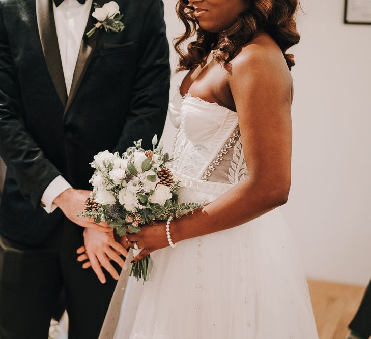 Bride and groom holding hands during Pump House Gallery wedding ceremony