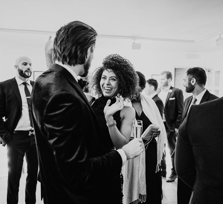 Wedding guest congratulating the groom