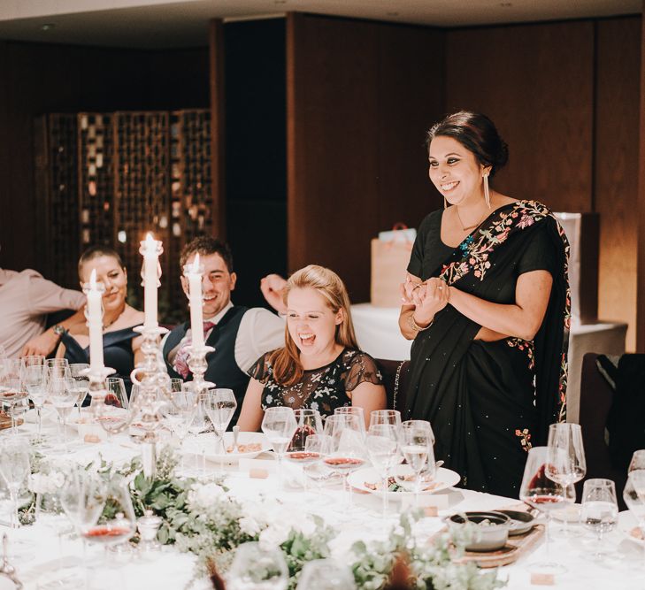 Wedding guests giving speeches at intimate wedding reception