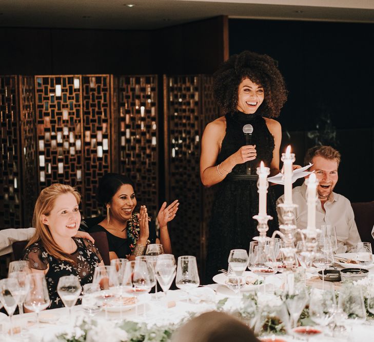 Wedding guests giving a speech at wedding reception