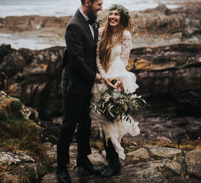 Coastal Portrait with Groom in Black Tie Suit and Top Knot and Bride in Catherine Deane Jessica Bodysuit and Anika Skirt Separates