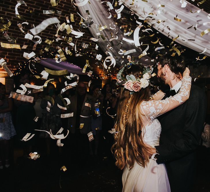 Dance Floor Confetti Bomb Moment with Bride in Catherine Deane Bridal Separates and Flower Crown and Groom in Tuxedo