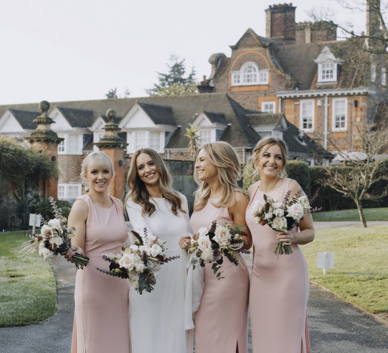 Bridal Party Portrait with Bridesmaids in Pink Whistles Dresses and Bride in Emma Beaumont Wedding Dress