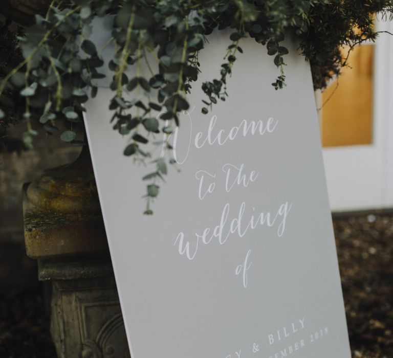 Grey Wedding Welcome Sign with White Calligraphy Writing and Candle Decor