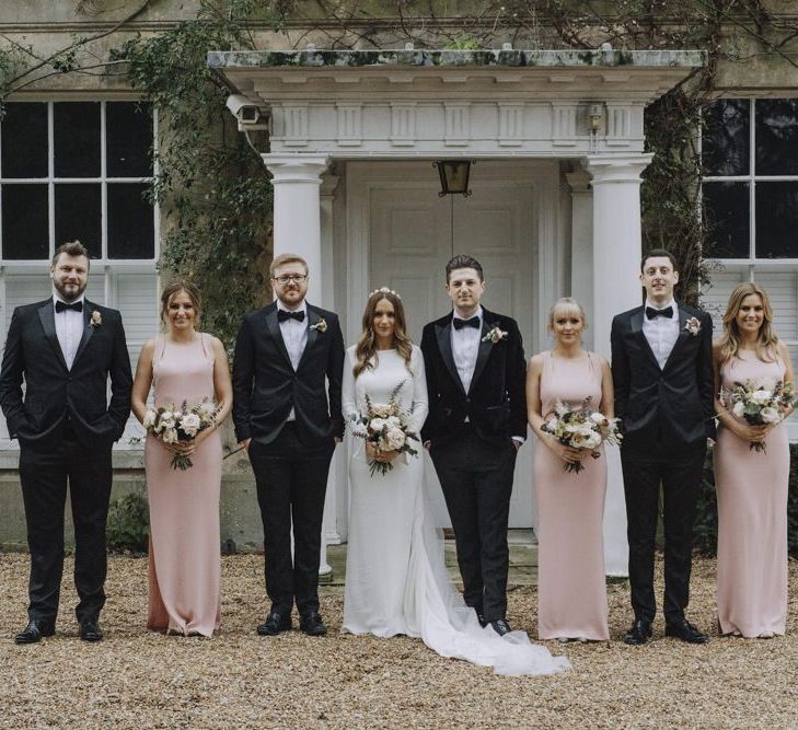 Wedding Party Portrait with Bride in Emma Beaumont Dress, Bridesmaids in Pink Dresses and Groomsmen in Tuxedos