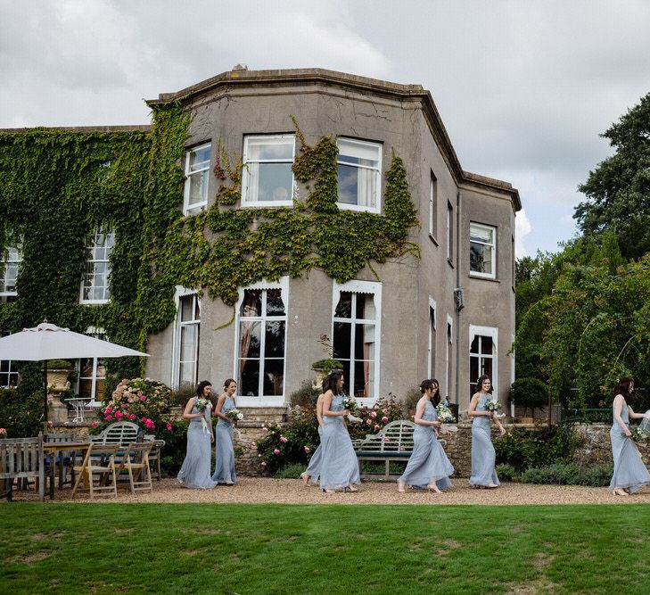 Bridal Party Walking Past Pennard House Wedding Venue