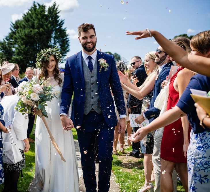 Confetti Moment with Bride in Charlie Brear Wedding Dress and Groom in Navy Ted Baker Suit