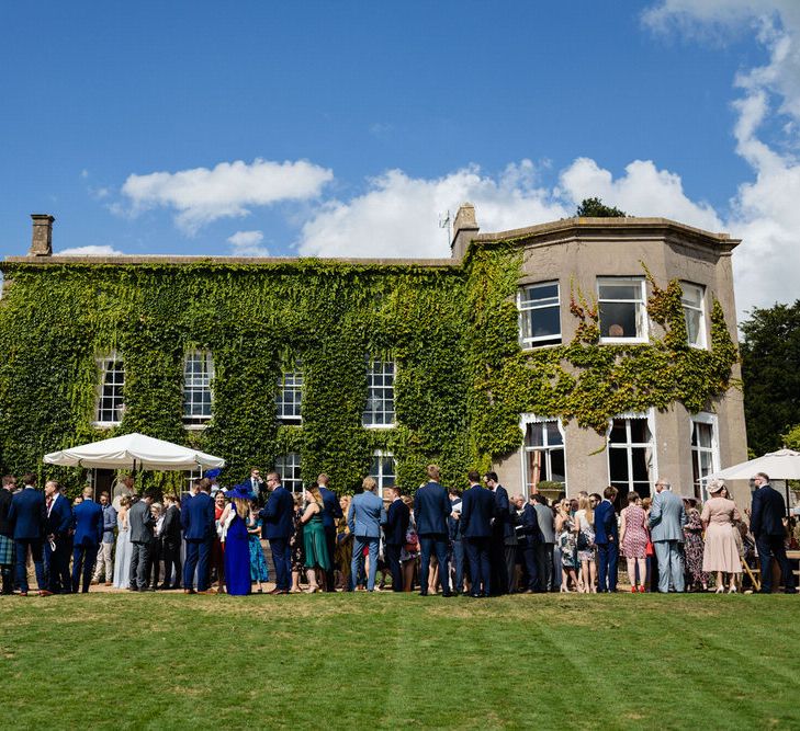 Wedding Guests Enjoying Drinks Reception at Pennard House Wedding Venue