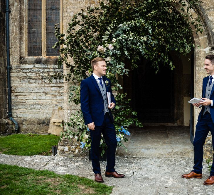 Ushers in Navy Blue Suits Standing Outside the Church