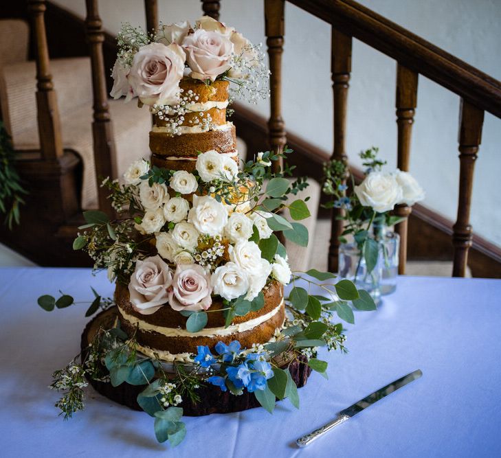 Naked Wedding Cake with Wild Flower Wedding Decor