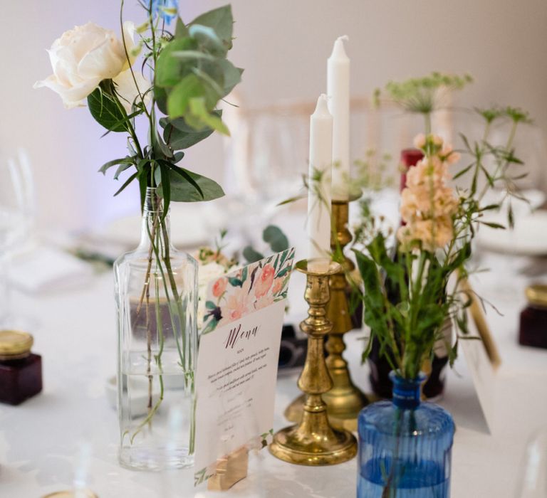 Flower Stems in Vases and Candles Sticks as Wedding Reception Table Centrepiece Decor