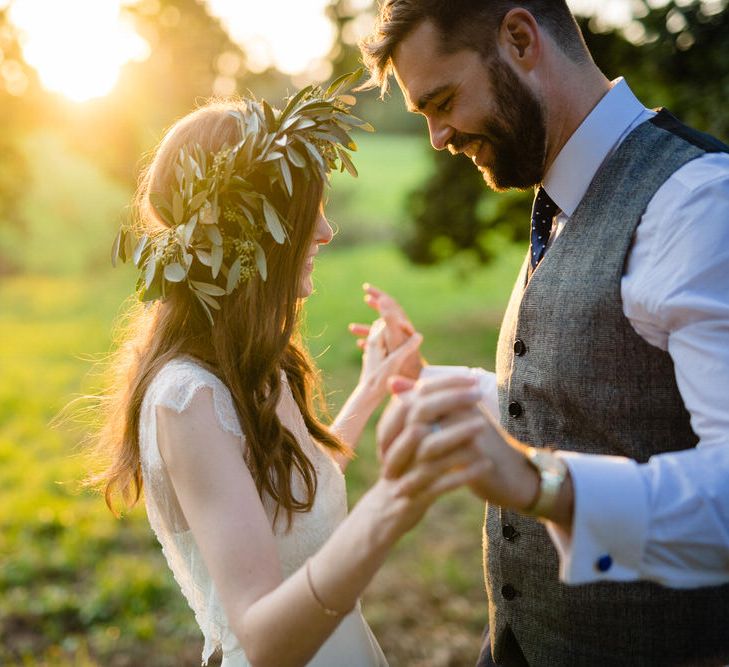 Golden Hour Portrait of Bride in Charlie Brear Wedding Dress and Olive Flower Crown with Groom in Ted Baker Navy Suit