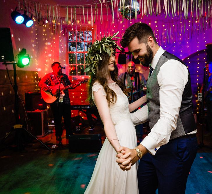 First Dance with Bride in Charlie Brear Wedding Dress and Olive Flower Crown with Groom in Ted Baker Navy Suit