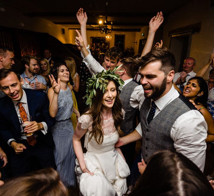 Evening Reception with Bride in Charlie Brear Wedding Dress and Olive Flower Crown with Groom in Ted Baker Navy Suit