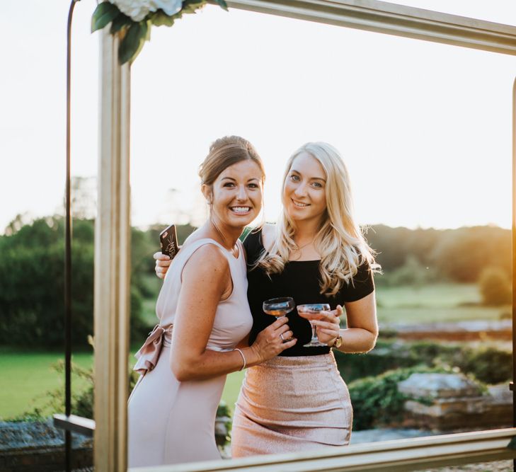 Wedding Guests Posing in Gold Frame