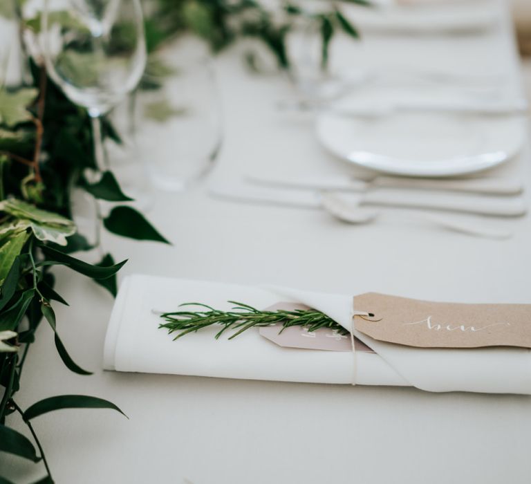 Elegant Place Setting with Luggage Tag and Rosemary Sprig