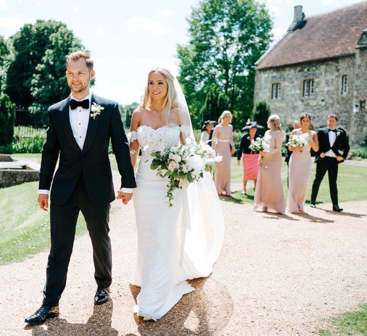 Bride and Groom in the Church Courtyard