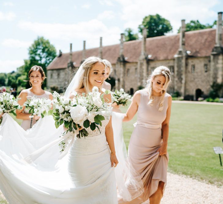 Bride and Bridesmaids in the Church Courtyard