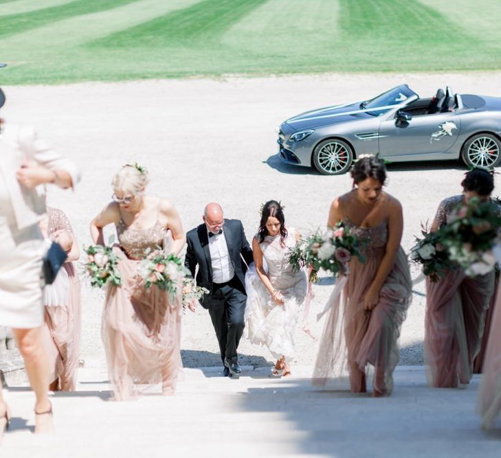 Bridal party arrives at Lulworth Castle wedding