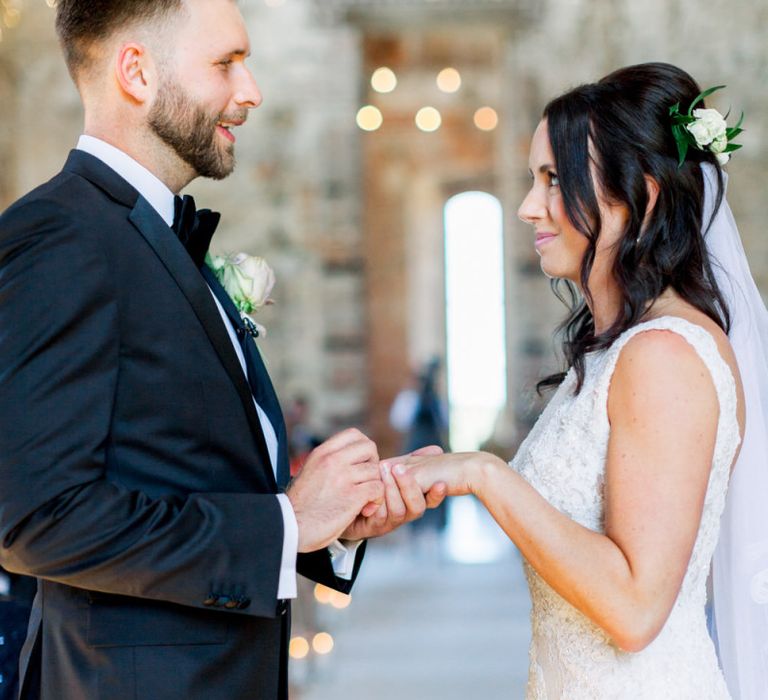 Bride and groom exchange rings