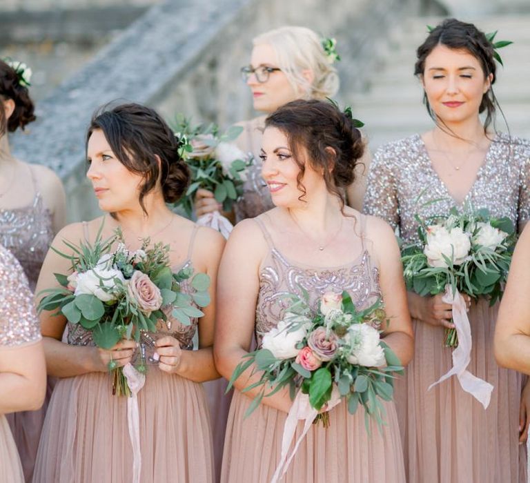 Pink bridesmaid dresses with beautiful bouquet