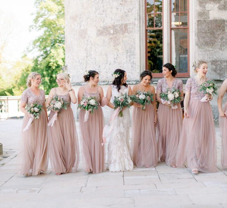 Pink bridesmaid dresses with beautiful bouquet