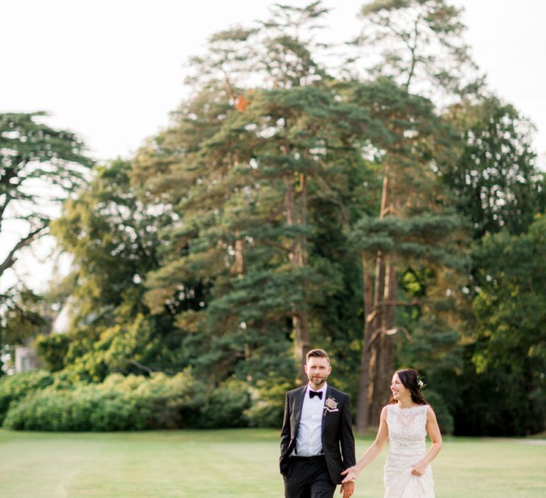 Bride and groom at black tie Lulworth Castle wedding