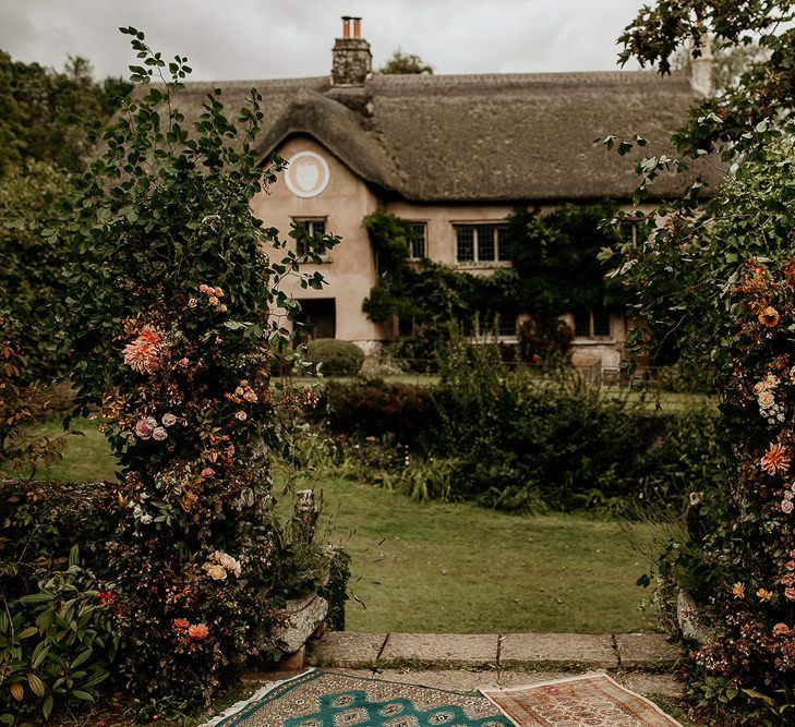 Devon wedding venue for with flower pillars for September wedding