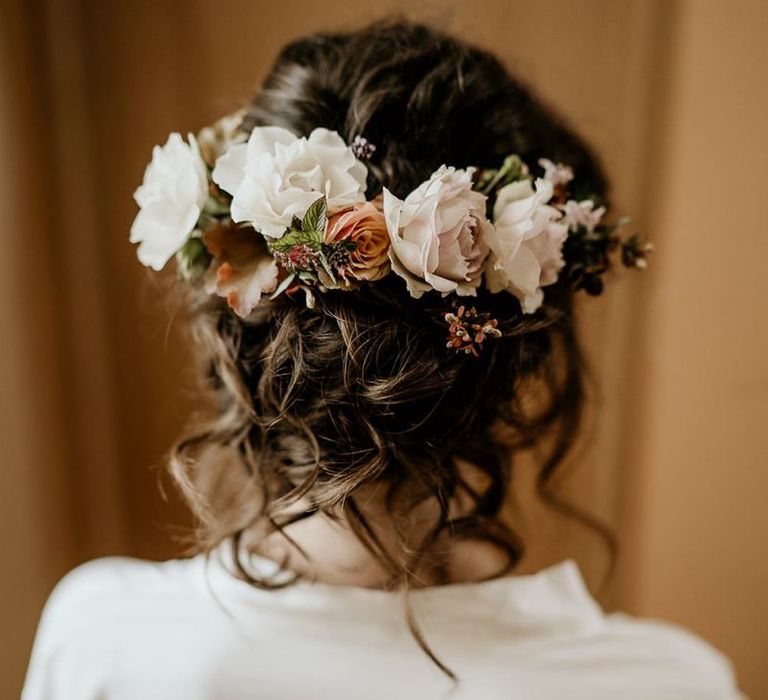 Floral hairpiece with pinned undo for bride