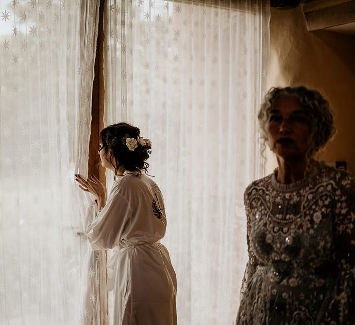 Bride takes a peak at September wedding ceremony set-up