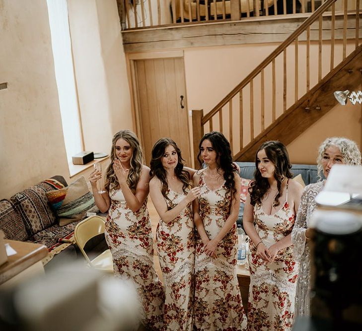 Bridesmaids wear floral dresses for September wedding