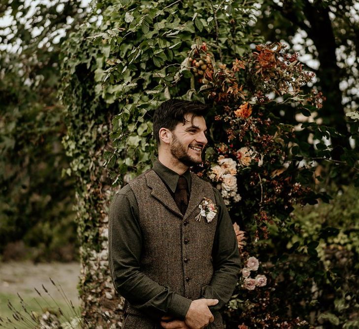 Groom waiting for bride at September wedding