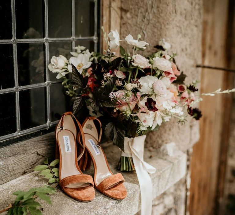 Wedding flowers with wedding shoes for September wedding