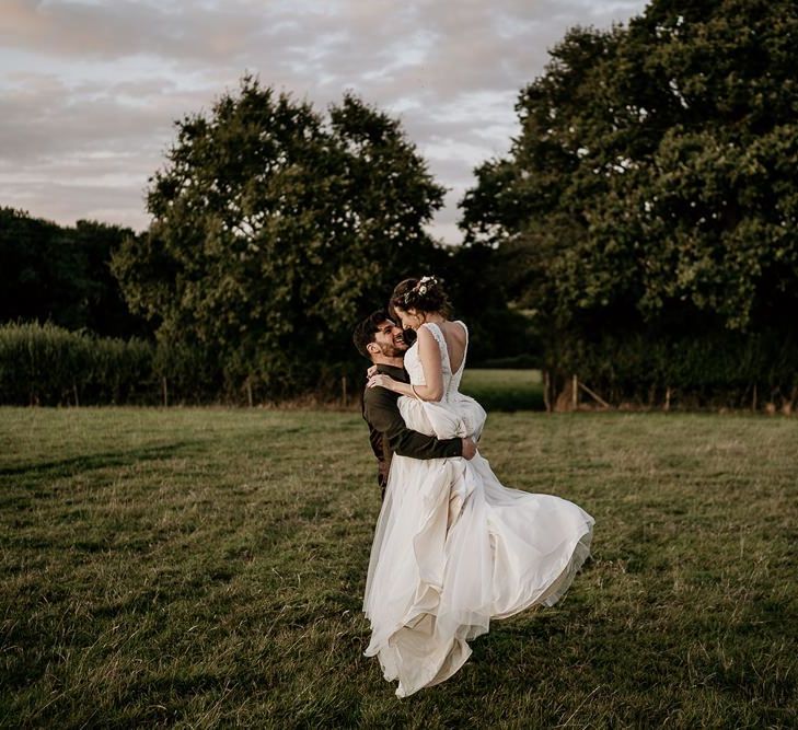 Bride and groom steal a moment during September wedding