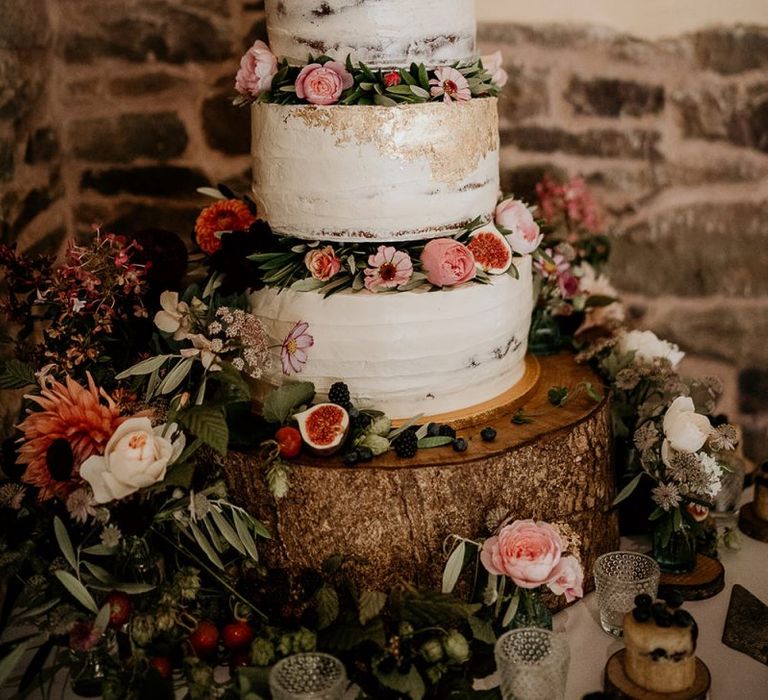 Semi-naked wedding cake with flower decor