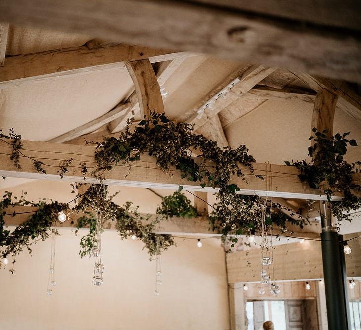 Exposed beams at barn wedding