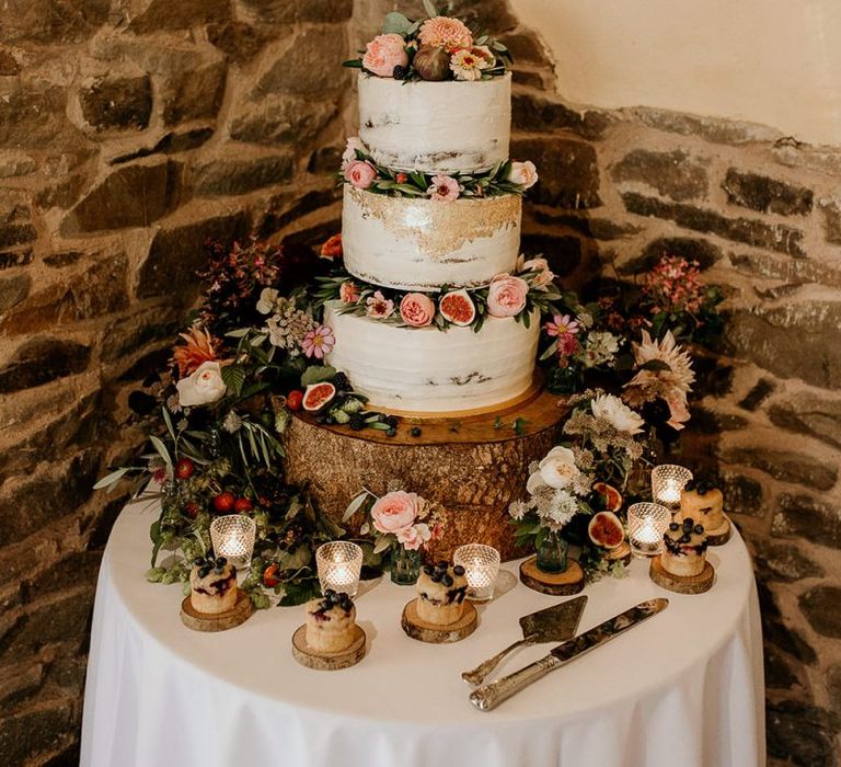 Gold foil wedding cake with flower decor