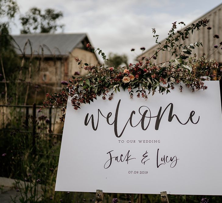 Wedding welcome sign with flower decor