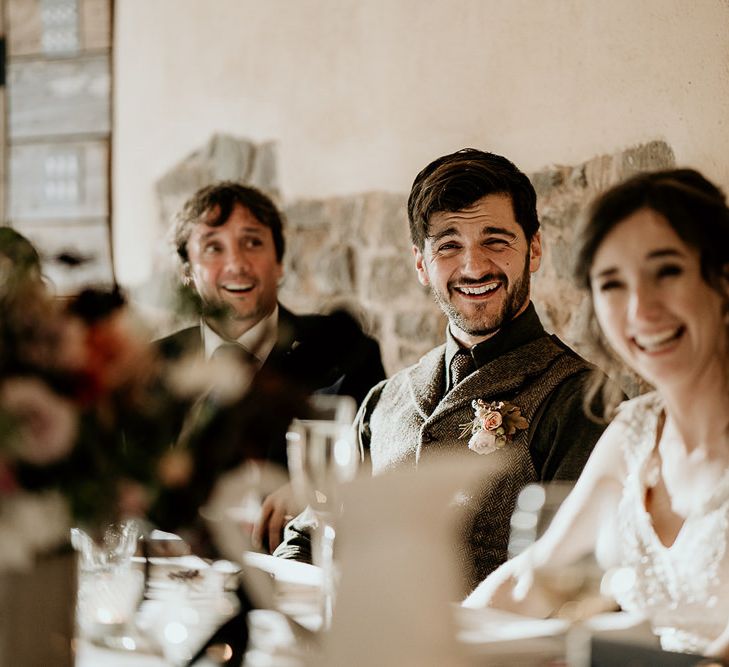 Bride and groom enjoy the wedding speeches